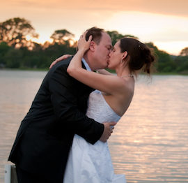 Elopement couple kissing on waterfront