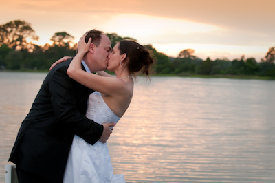 Elopement couple kissing on waterfront