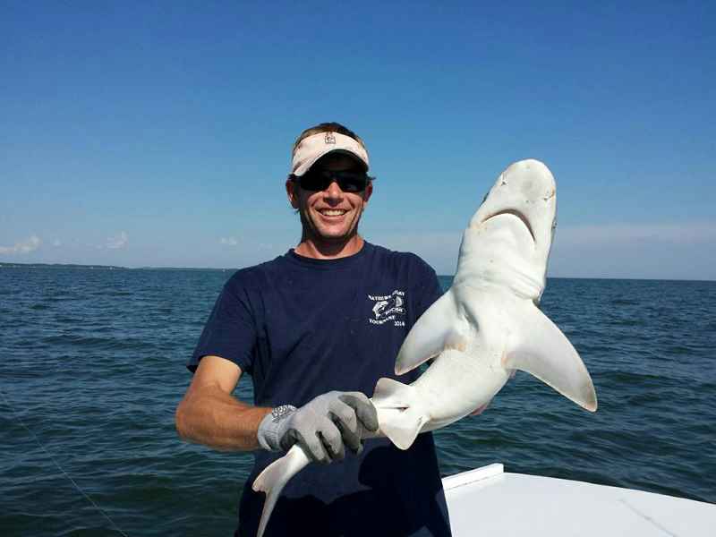Captain Trey Sowers with small shark.