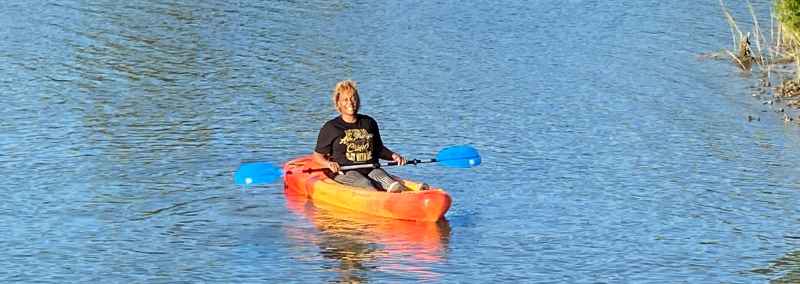 Woman kayaking on the bay