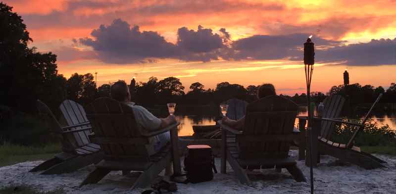 Couple enjoying romantic evening at the creekside fire pit.