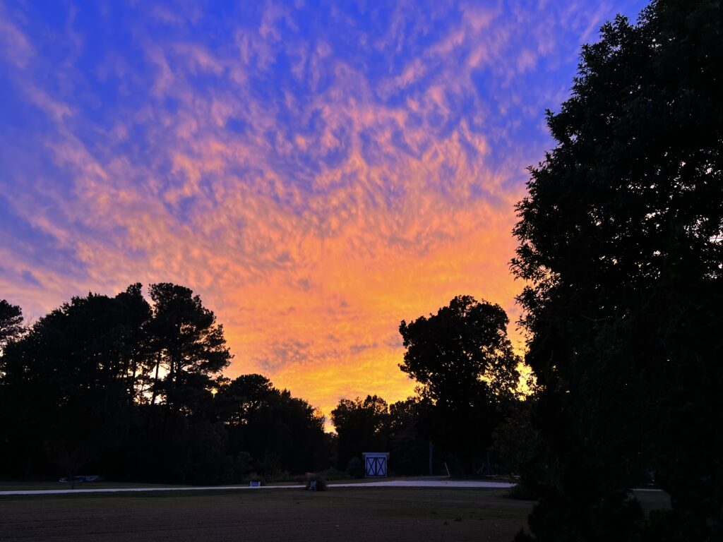 Colorful sky over the bocci ball court.