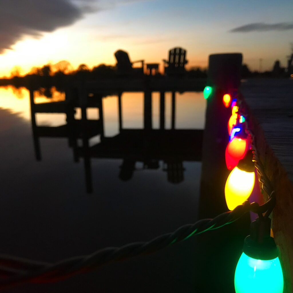 View of the Inns dock with lights at sunset.