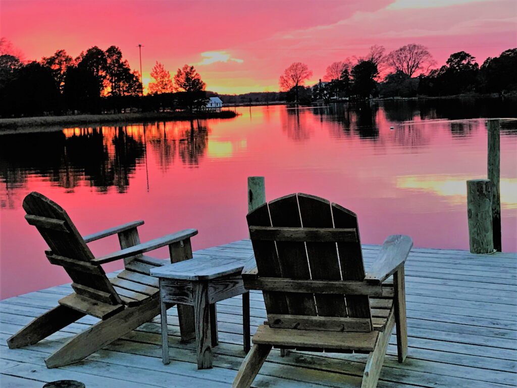 The Adirondack chairs at the end of our dock are the prime seat for Mathews County sunsets. 