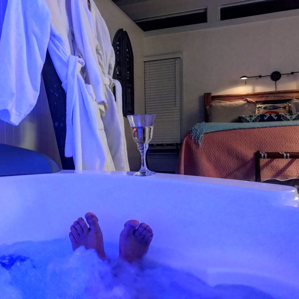Relax in the jetted tub in your suite with a glass of wine.