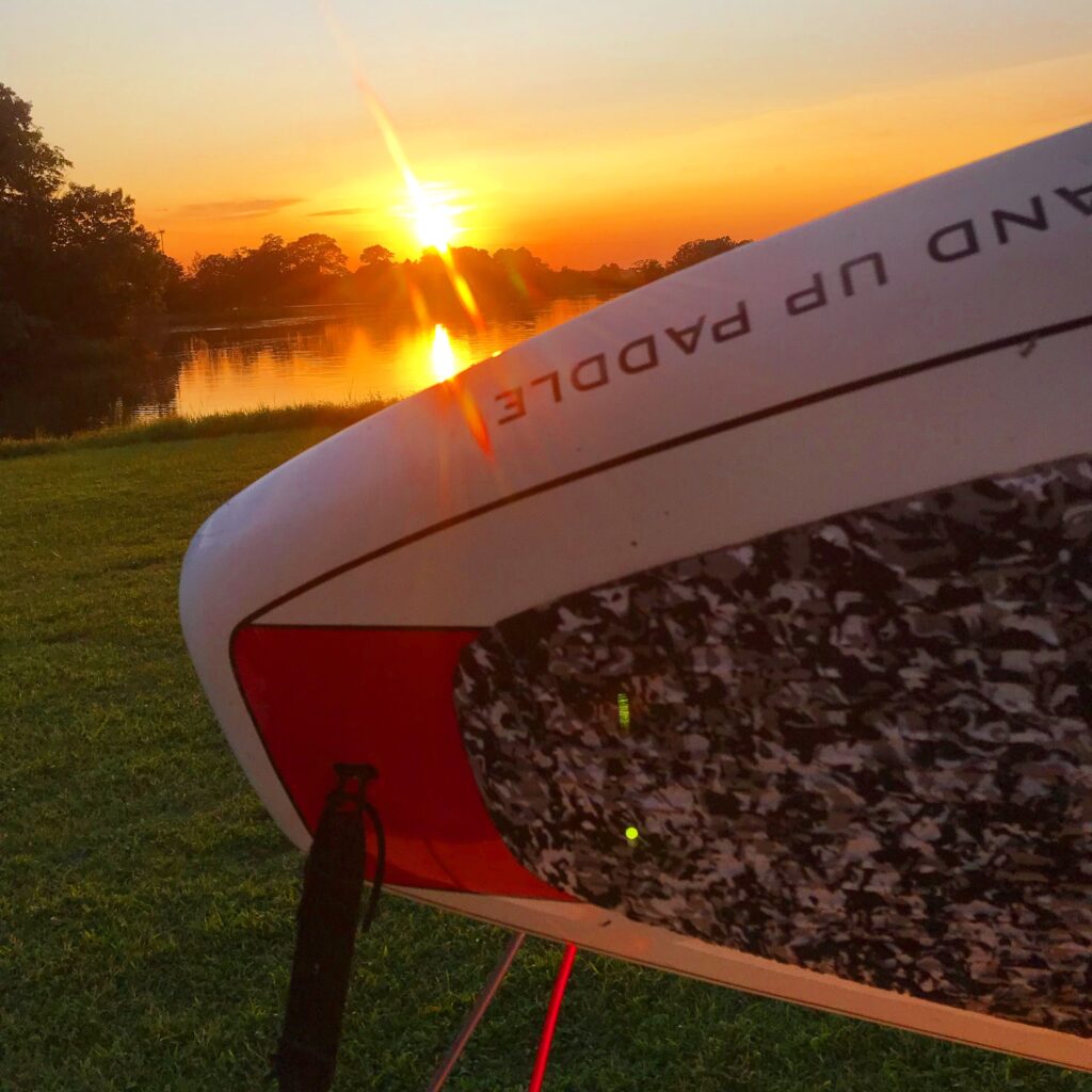 sup boards at sunset