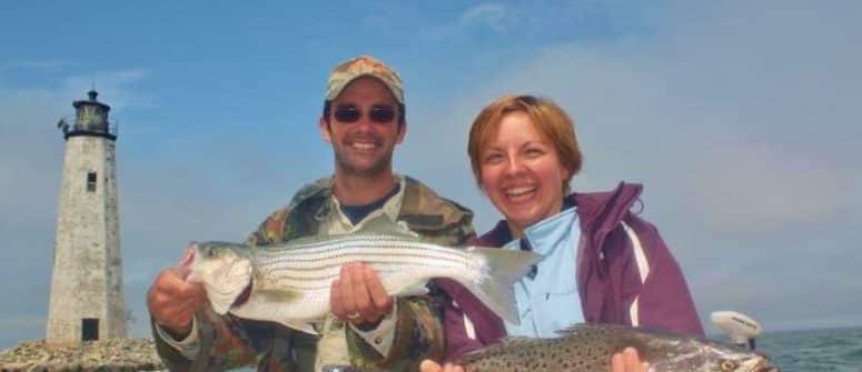 guests posing with fish