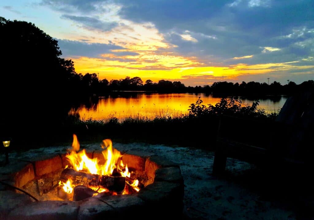 Creekside wood burning fire pit in winter.