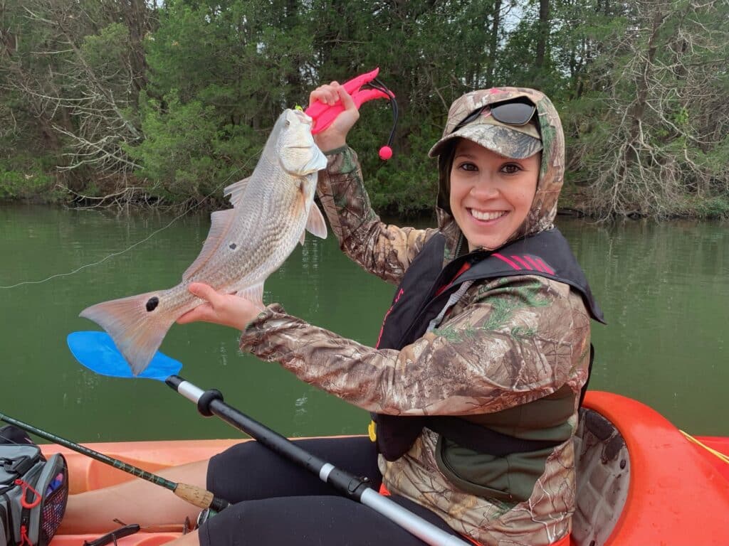 Guests kayak fishing