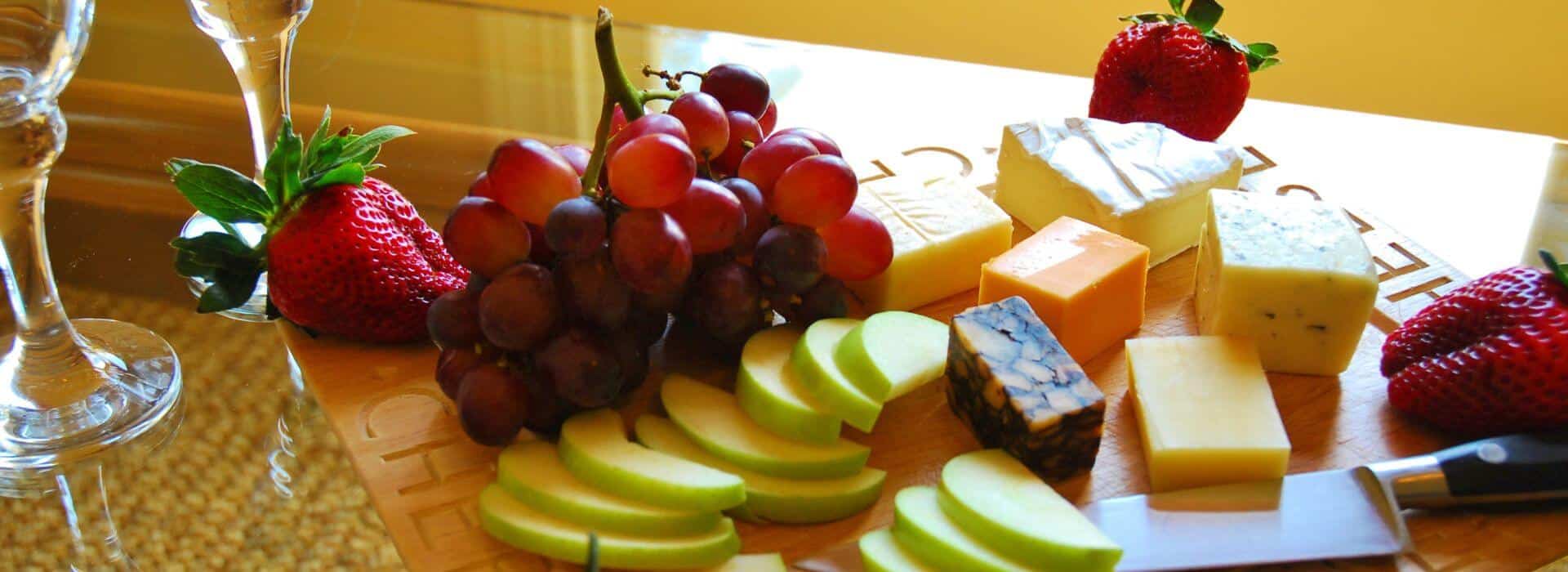 Close up view of charcuterie board with fruit and cheese